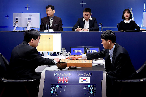 SEOUL, SOUTH KOREA - MARCH 10: In this handout image provided by Google, South Korean professional Go player Lee Se-Dol (R) puts his first stone against Google's artificial intelligence program, AlphaGo, during the Google DeepMind Challenge Match on March 10, 2016 in Seoul, South Korea. Lee Se-dol is playing a five-match series against a computer program developed by a Google, AlphaGo. (Photo by Google via Getty Images)